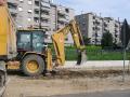 scavo per cordoli pista ciclabile con Caterpillar 428D