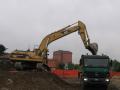 Caterpillar 325B LN e Mercedes-Benz 4144