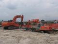Hitachi Zaxis 350LCN con pinza e Fiat Kobelco E 235 con frantumatore