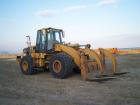 Caterpillar 962 G con pinza per tubi 3