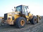 Caterpillar 962 G con pinza per tubi 2