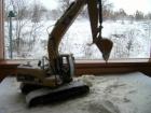 cat 320DL al lavoro sotto la neve