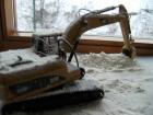 cat 320DL al lavoro sotto la neve