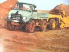 Unimog con scraper